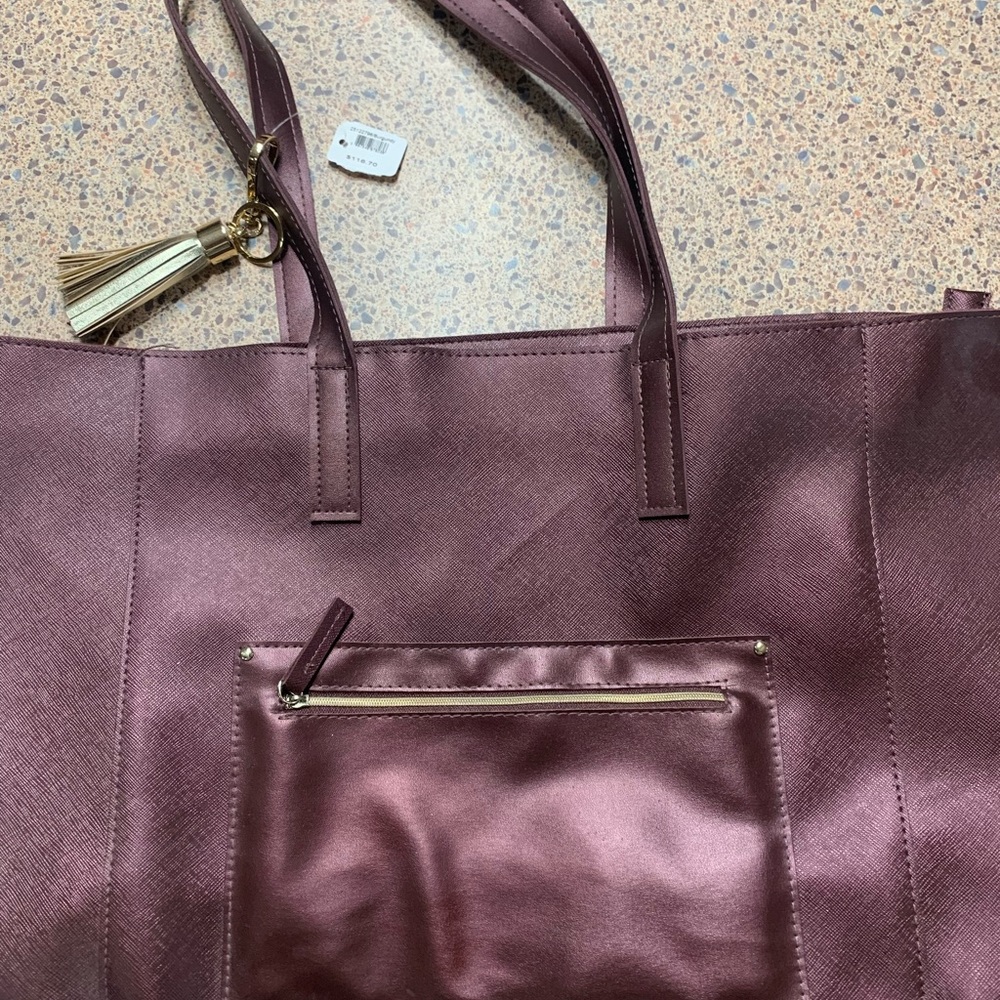 Bath and body works. Burgundy tote, new with tags. Smoke free home.